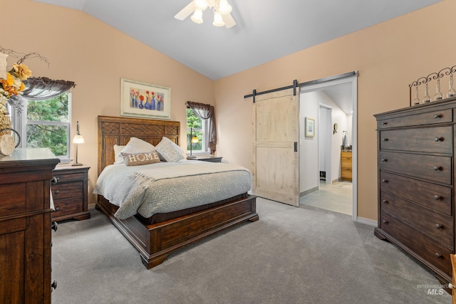 1611 Woodhaven Ln, Mccall, ID 83638 - carpeted bedroom featuring a barn door, lofted ceiling, baseboards, and ceiling fan