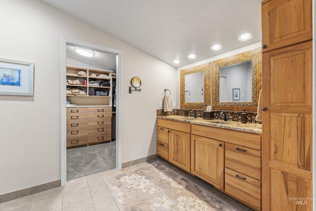 1611 Woodhaven Ln, Mccall, ID 83638 - full bath featuring double vanity, lofted ceiling, a spacious closet, baseboards, and recessed lighting