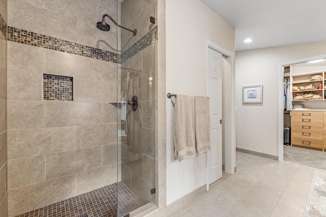 1611 Woodhaven Ln, Mccall, ID 83638 - full bathroom with a shower stall, baseboards, a walk in closet, recessed lighting, and tile patterned floors