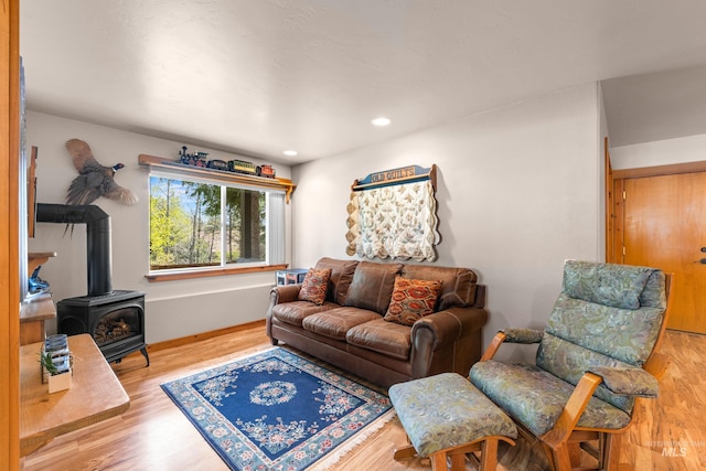 1611 Woodhaven Ln, Mccall, ID 83638 - living room with a wood stove, wood finished floors, baseboards, and recessed lighting