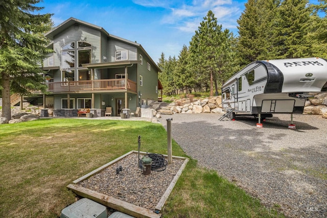 1611 Woodhaven Ln, Mccall, ID 83638 - view of property exterior with a lawn and a wooden deck