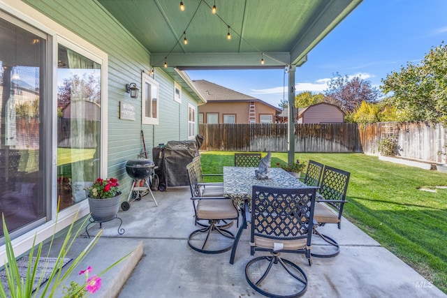 view of patio / terrace featuring outdoor dining space, a fenced backyard, and grilling area