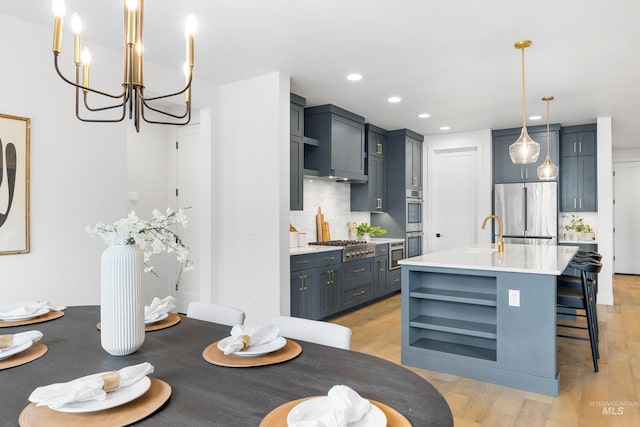 dining room featuring light wood-style floors, recessed lighting, and a chandelier