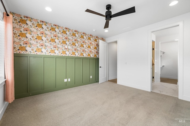 unfurnished bedroom with visible vents, a wainscoted wall, baseboards, wallpapered walls, and recessed lighting
