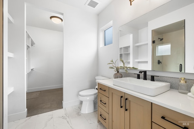 full bathroom with vanity, toilet, marble finish floor, visible vents, and a stall shower