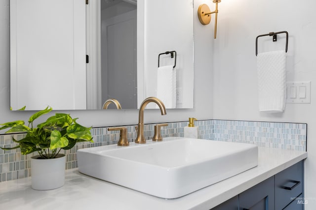 bathroom featuring decorative backsplash and vanity