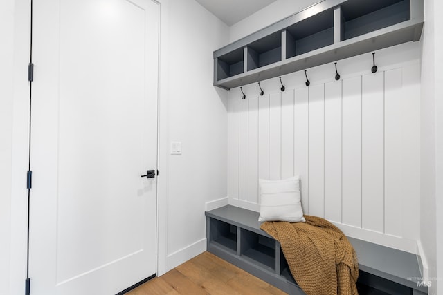mudroom with baseboards and light wood-style floors