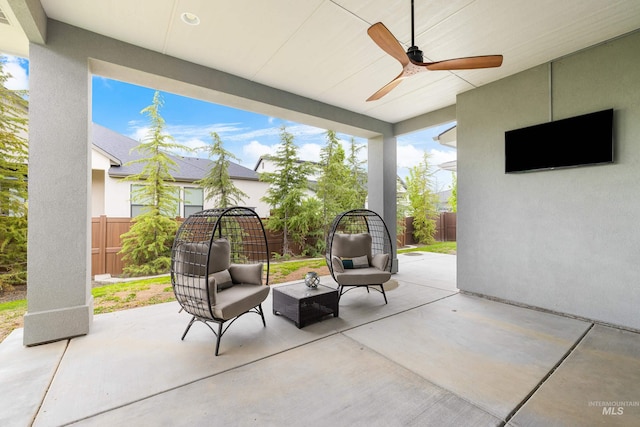 view of patio / terrace featuring outdoor lounge area, a ceiling fan, a fenced backyard, and visible vents