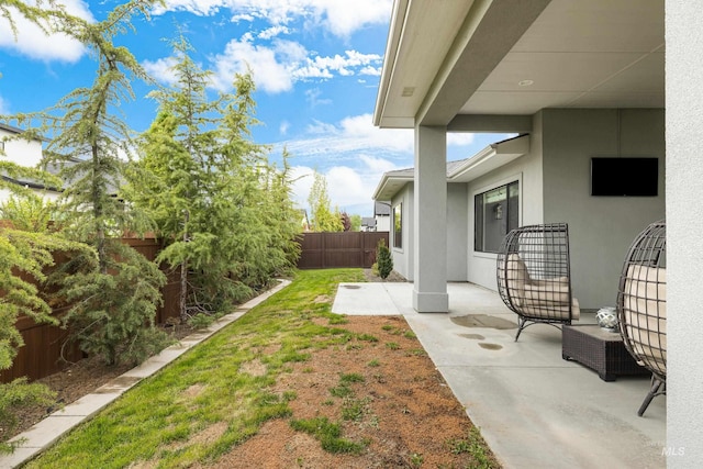 view of yard with a patio and a fenced backyard