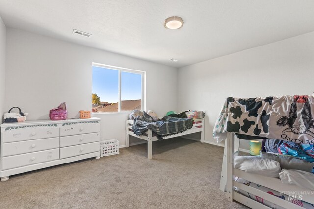 bedroom featuring carpet floors and baseboards