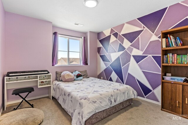 carpeted bedroom featuring baseboards