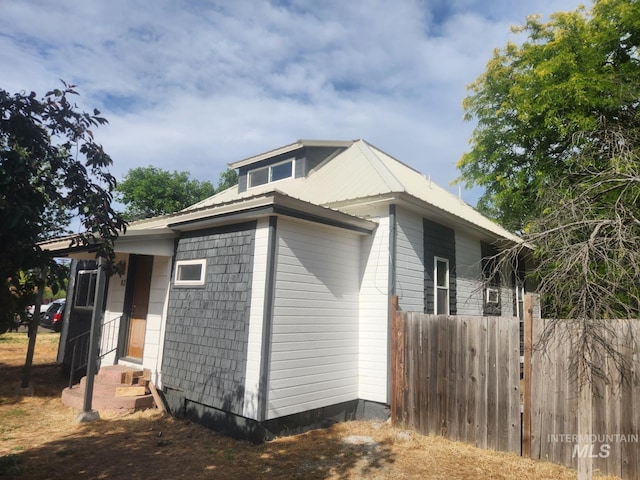 82 NW 3rd St, Ontario, OR 97914 - view of side of property featuring a metal roof and entry steps