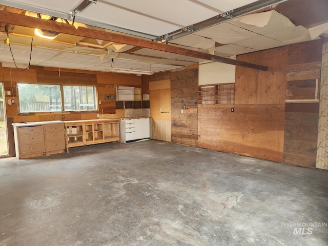 82 NW 3rd St, Ontario, OR 97914 - garage featuring wood walls