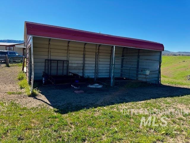view of outbuilding featuring a carport