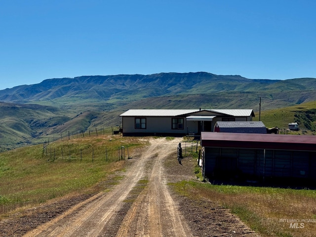 view of mountain background featuring rural landscape