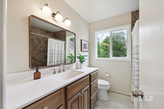 full bathroom featuring baseboard heating, toilet, vanity, a shower with shower curtain, and baseboards