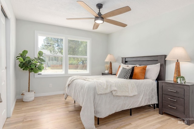 3716 W Palouse St, Boise, ID 83705 - bedroom featuring light wood-style flooring, baseboards, and a ceiling fan