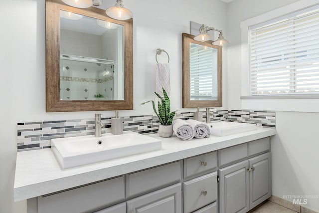 3716 W Palouse St, Boise, ID 83705 - full bath with double vanity, tasteful backsplash, and a shower with door
