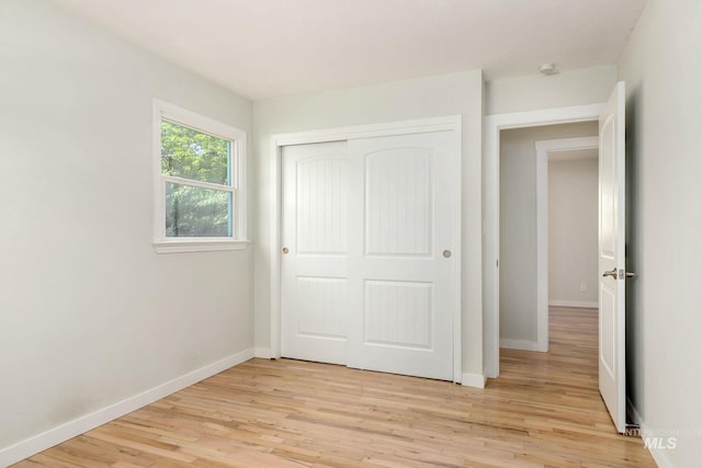 3716 W Palouse St, Boise, ID 83705 - unfurnished bedroom featuring baseboards, light wood-style flooring, and a closet
