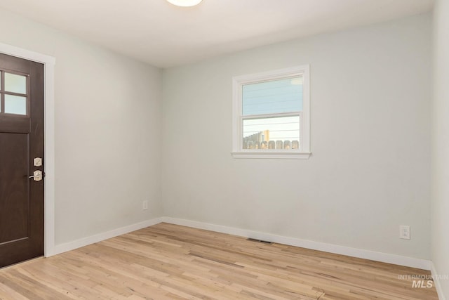 3716 W Palouse St, Boise, ID 83705 - empty room featuring plenty of natural light, light wood-type flooring, and baseboards