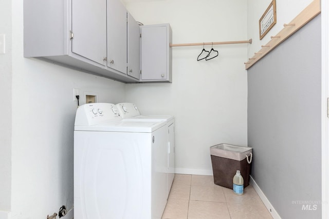 3716 W Palouse St, Boise, ID 83705 - laundry room featuring cabinet space, separate washer and dryer, light tile patterned flooring, and baseboards