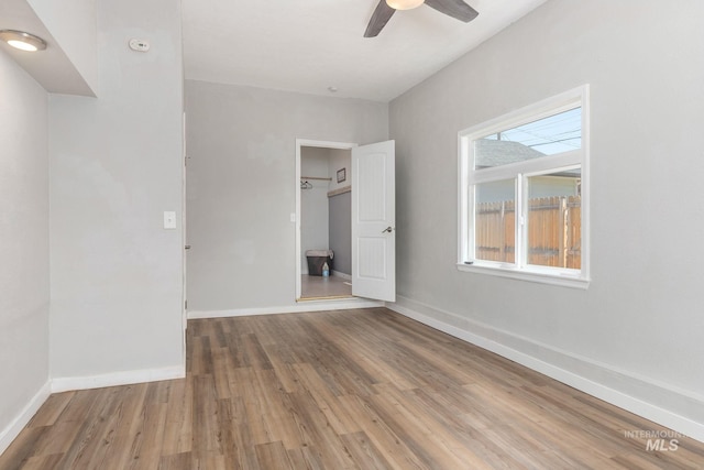 3716 W Palouse St, Boise, ID 83705 - unfurnished bedroom with wood finished floors, baseboards, and ceiling fan