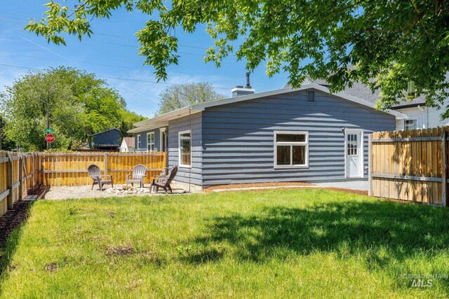 3716 W Palouse St, Boise, ID 83705 - rear view of property with an outdoor fire pit
