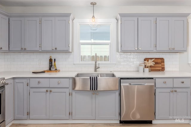 3716 W Palouse St, Boise, ID 83705 - kitchen featuring stainless steel appliances, a sink, and gray cabinets