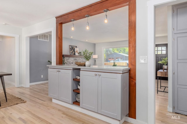 3716 W Palouse St, Boise, ID 83705 - kitchen with light wood-style flooring, open shelves, light countertops, and baseboards