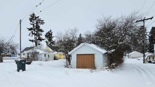 exterior space featuring an outbuilding and a garage