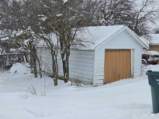 view of snow covered garage