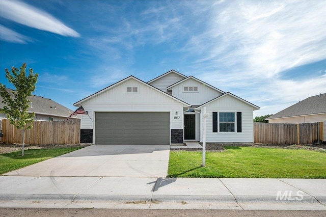 11177 Champlain Pl Unit 9, Caldwell, ID 83605 - view of front of home with a garage, driveway, and stone siding
