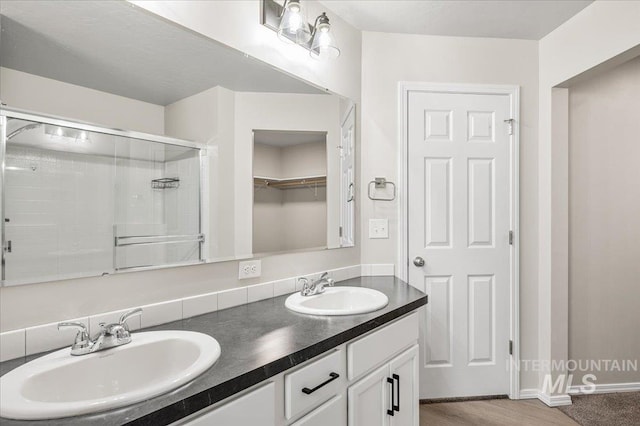 11177 Champlain Pl Unit 9, Caldwell, ID 83605 - full bath featuring double vanity, a shower stall, and a spacious closet