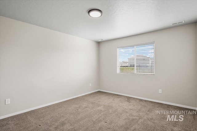 11177 Champlain Pl Unit 9, Caldwell, ID 83605 - carpeted empty room with baseboards