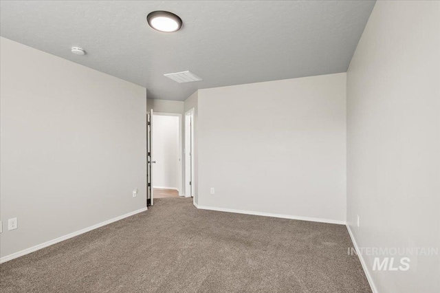 11177 Champlain Pl Unit 9, Caldwell, ID 83605 - empty room featuring carpet flooring and a smoke detector