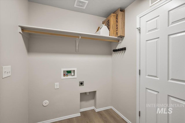 11177 Champlain Pl Unit 9, Caldwell, ID 83605 - laundry area featuring washer hookup, wood finished floors, hookup for an electric dryer, and cabinet space