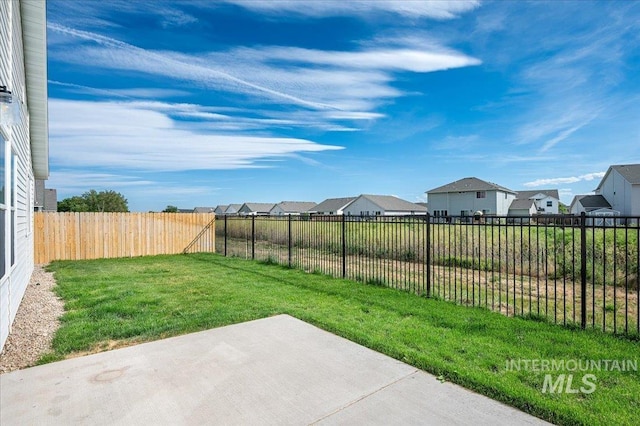 11177 Champlain Pl Unit 9, Caldwell, ID 83605 - fenced backyard with a patio area and a residential view