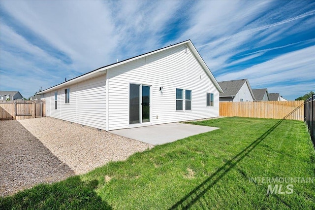 11177 Champlain Pl Unit 9, Caldwell, ID 83605 - back of house featuring a patio and a fenced backyard