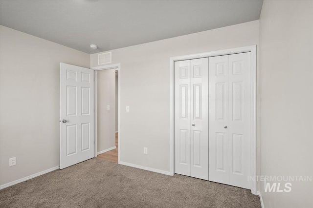 11177 Champlain Pl Unit 9, Caldwell, ID 83605 - unfurnished bedroom featuring carpet flooring and a closet