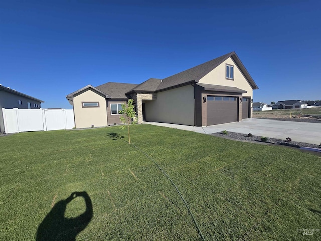 563 Full Moon Way, Twin Falls, ID 83301 - view of front of property featuring concrete driveway, a garage, and stucco siding
