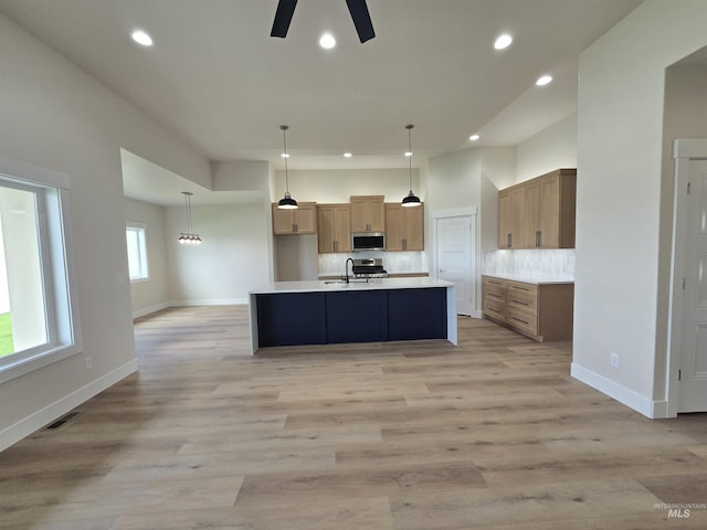 563 Full Moon Way, Twin Falls, ID 83301 - kitchen with stainless steel appliances, a ceiling fan, recessed lighting, light countertops, and tasteful backsplash