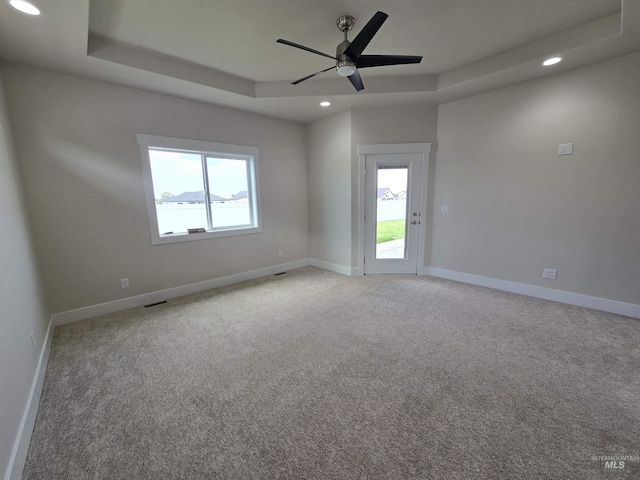 563 Full Moon Way, Twin Falls, ID 83301 - unfurnished room with recessed lighting, a ceiling fan, light colored carpet, and a tray ceiling