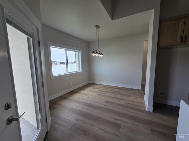 563 Full Moon Way, Twin Falls, ID 83301 - unfurnished dining area featuring light wood-type flooring
