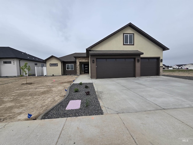 563 Full Moon Way, Twin Falls, ID 83301 - view of front facade featuring stucco siding and driveway