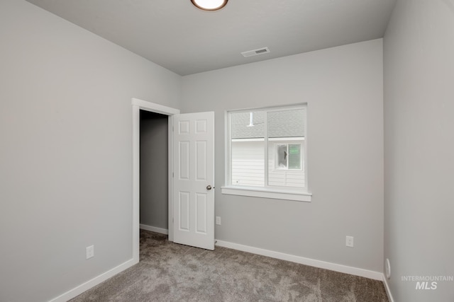 view of carpeted spare room