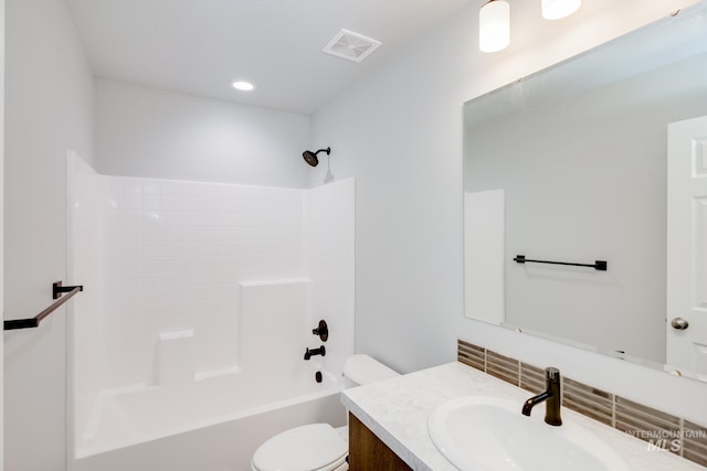 full bathroom featuring vanity, shower / bath combination, and toilet