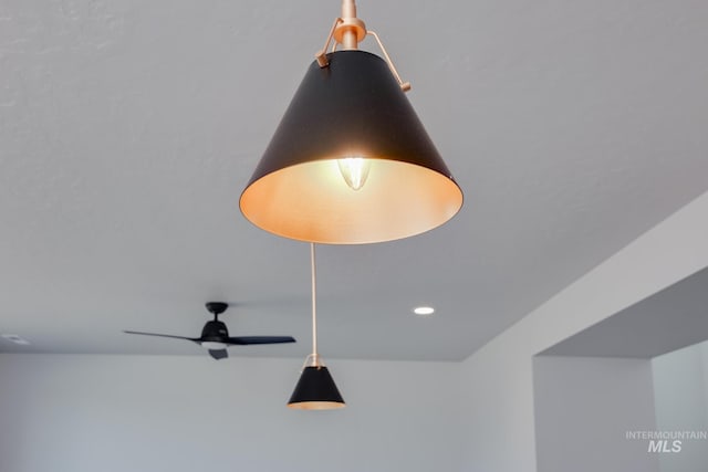 interior details featuring ceiling fan