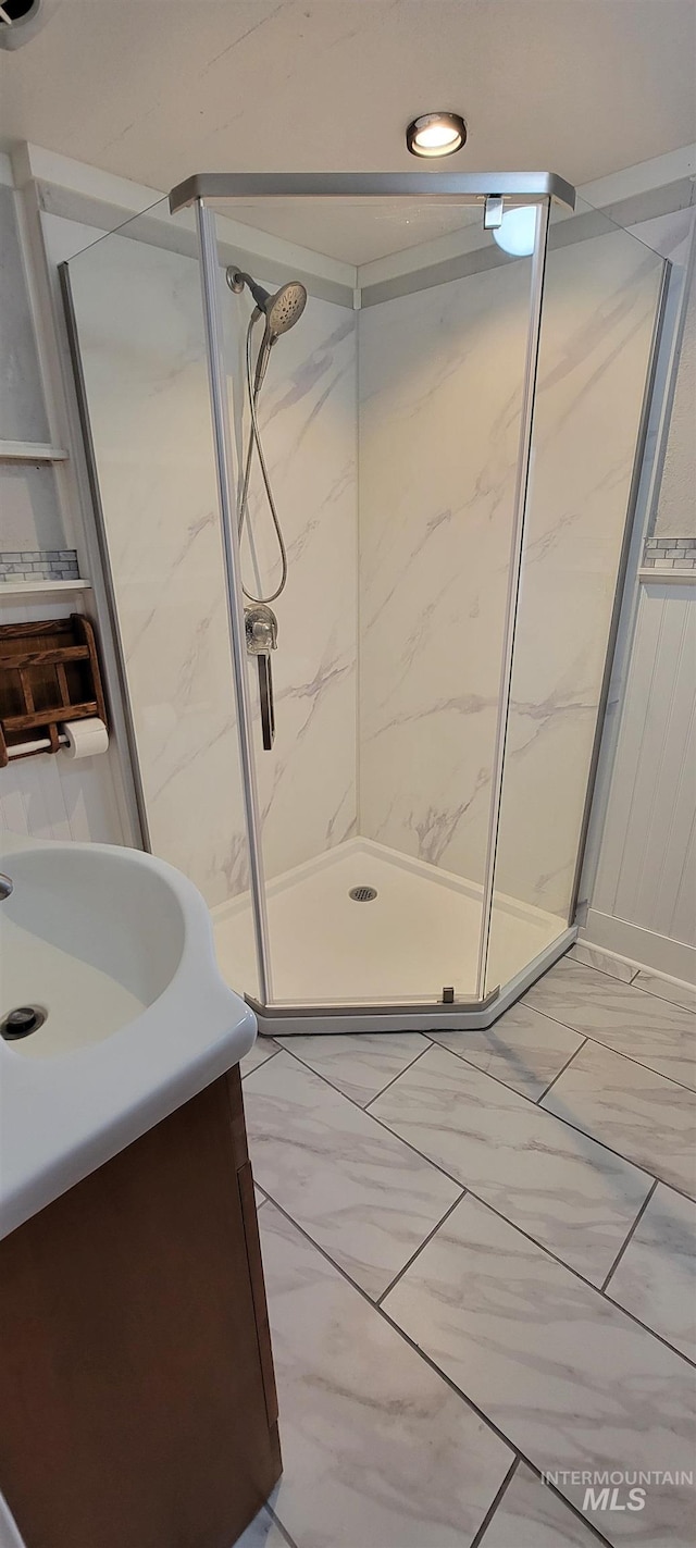 bathroom with an enclosed shower and vanity