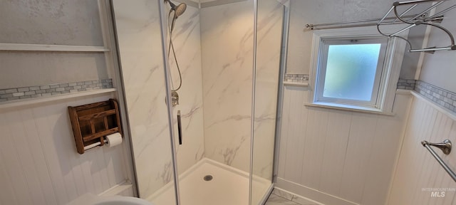 bathroom with walk in shower and wooden walls