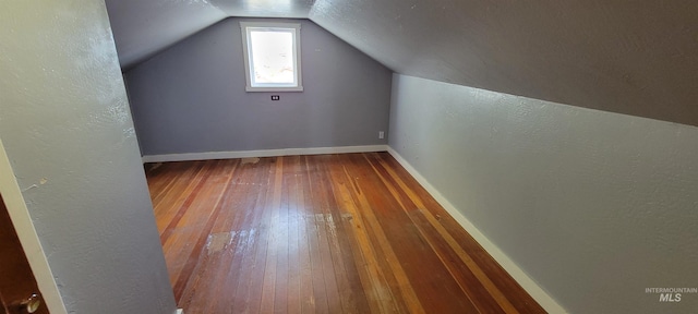 bonus room featuring wood-type flooring and lofted ceiling